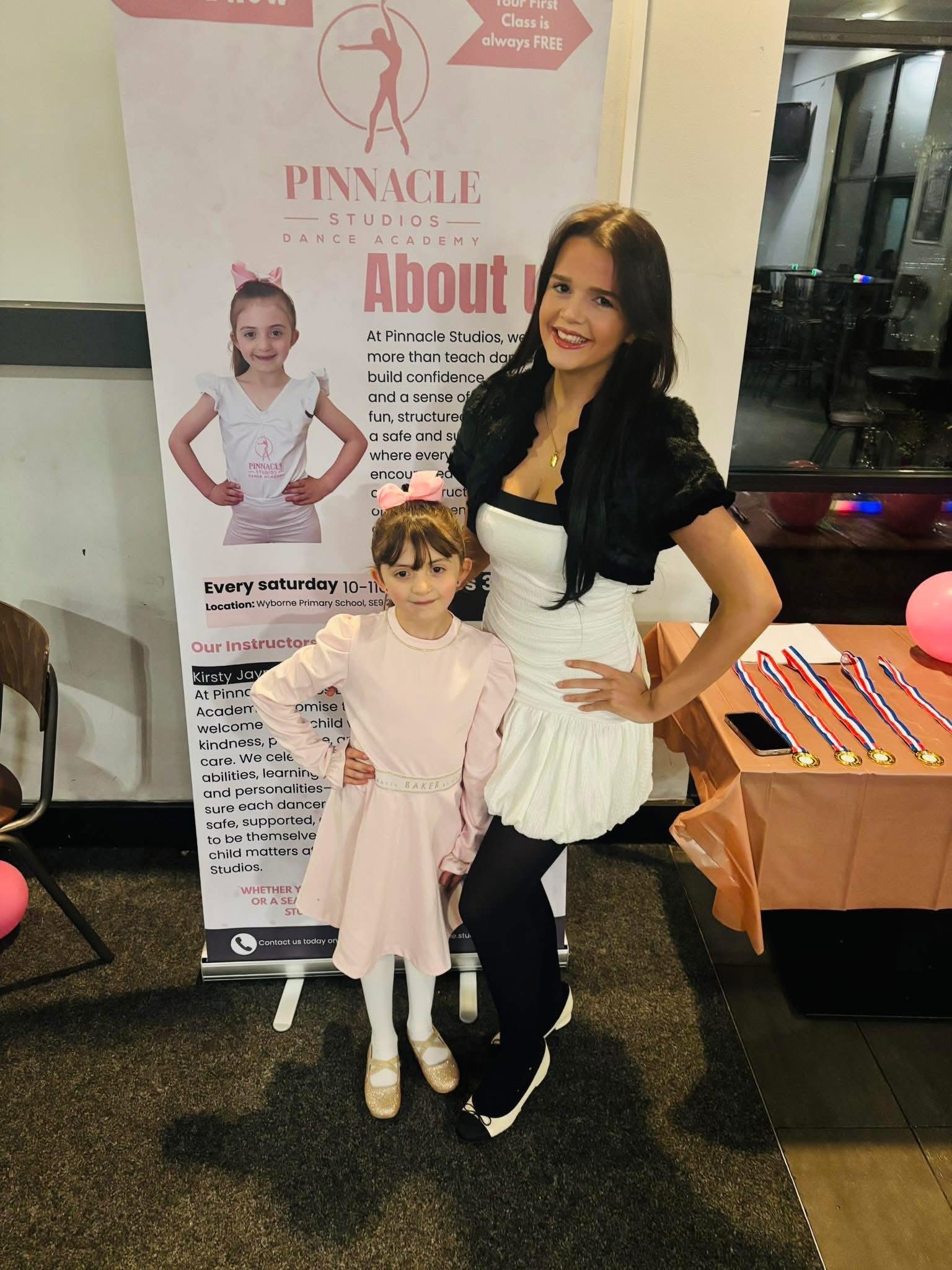Kirsty celebrating with a young dancer
