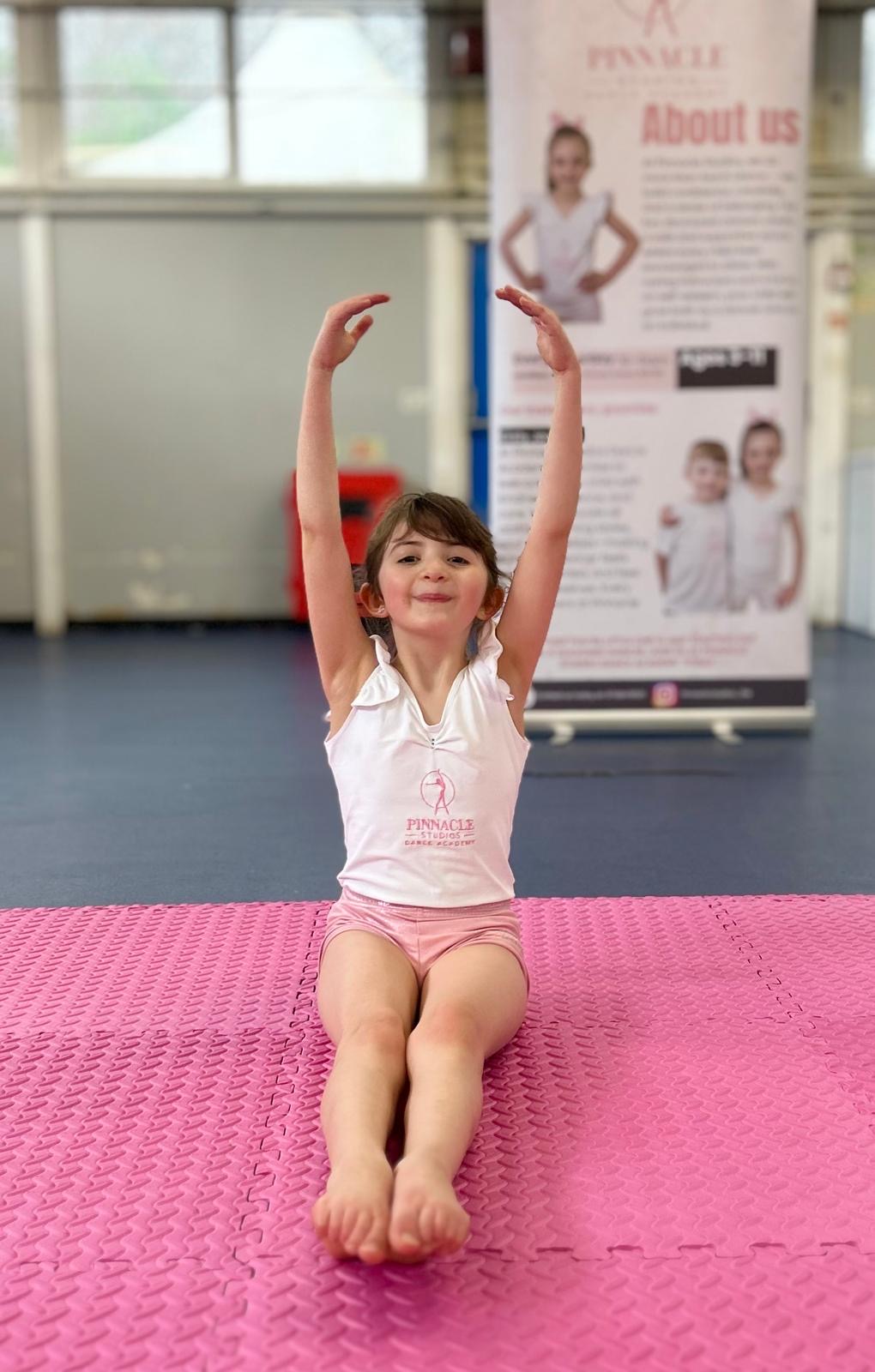 A young Pinnacle dancer finishing a seated pose